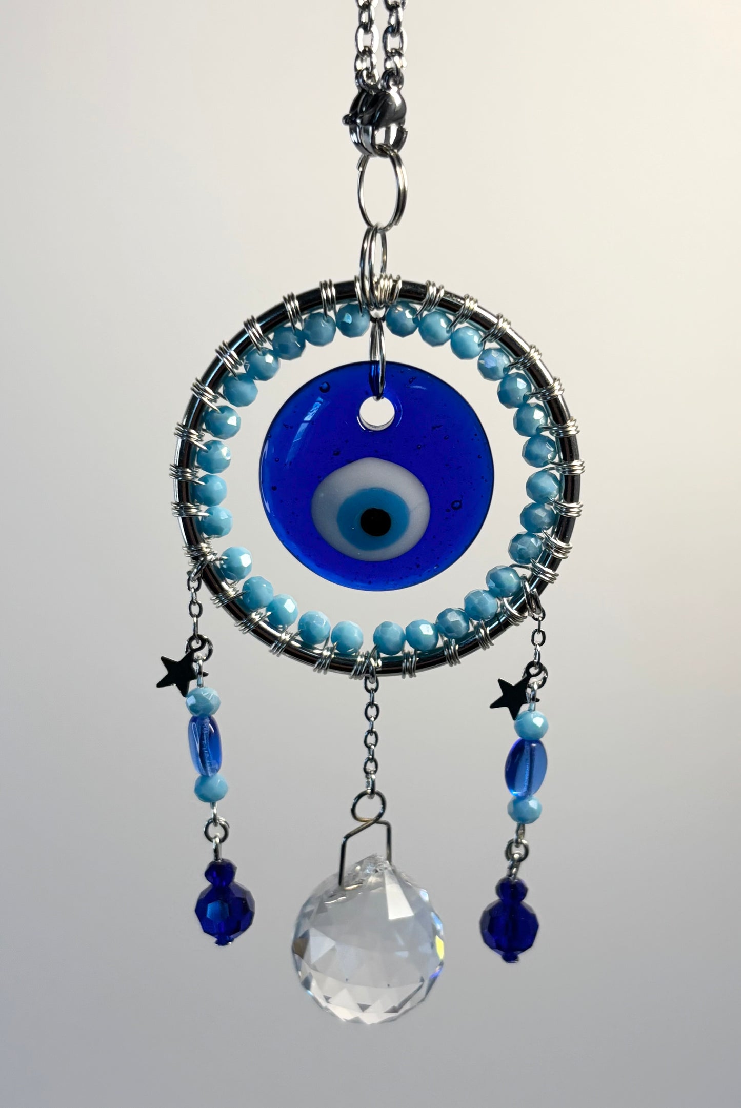 Silver Round Metal Frame with Light Blues & Evil Eye