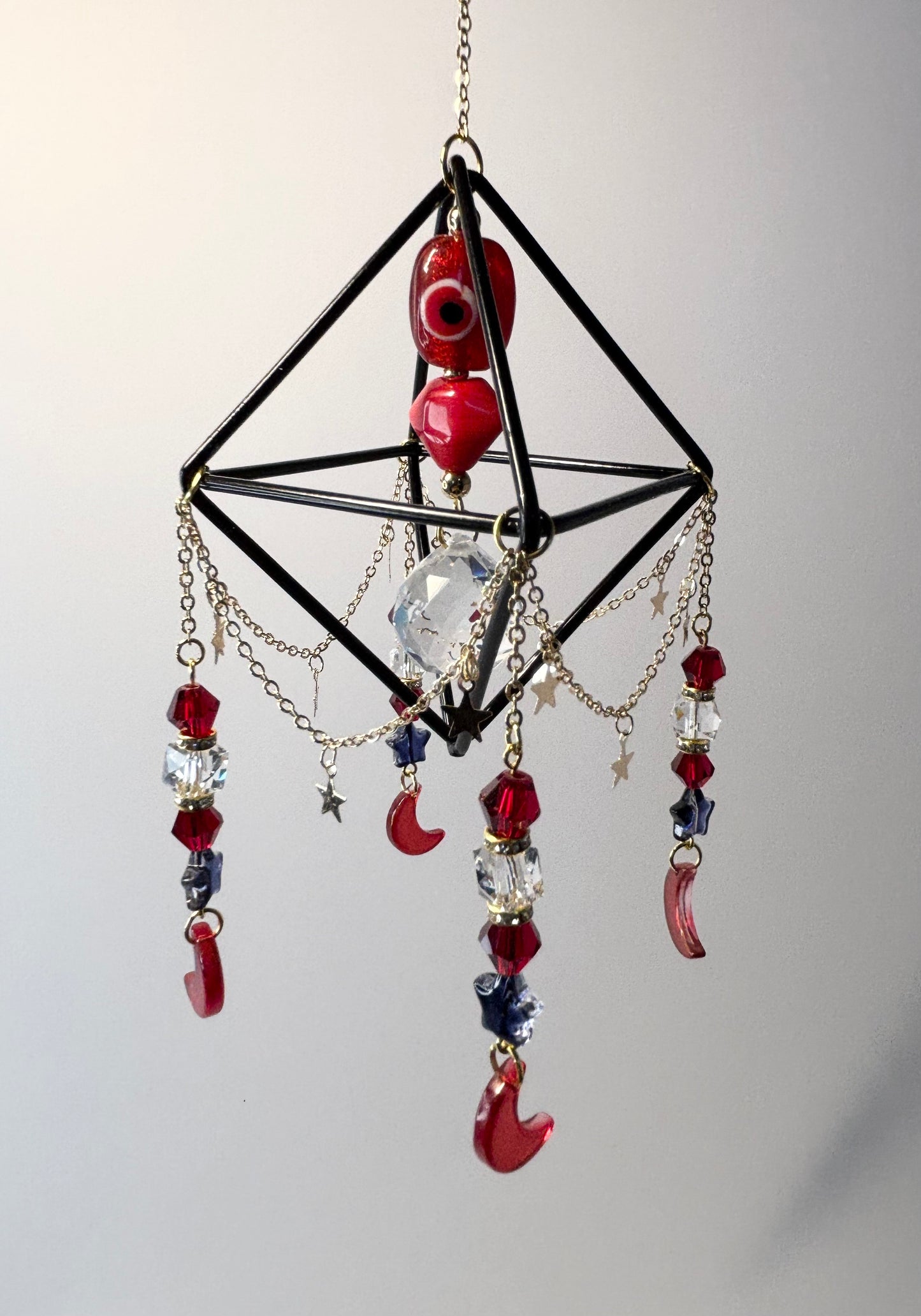 Black Geometric Frame with 4 Pendants, Red Moons