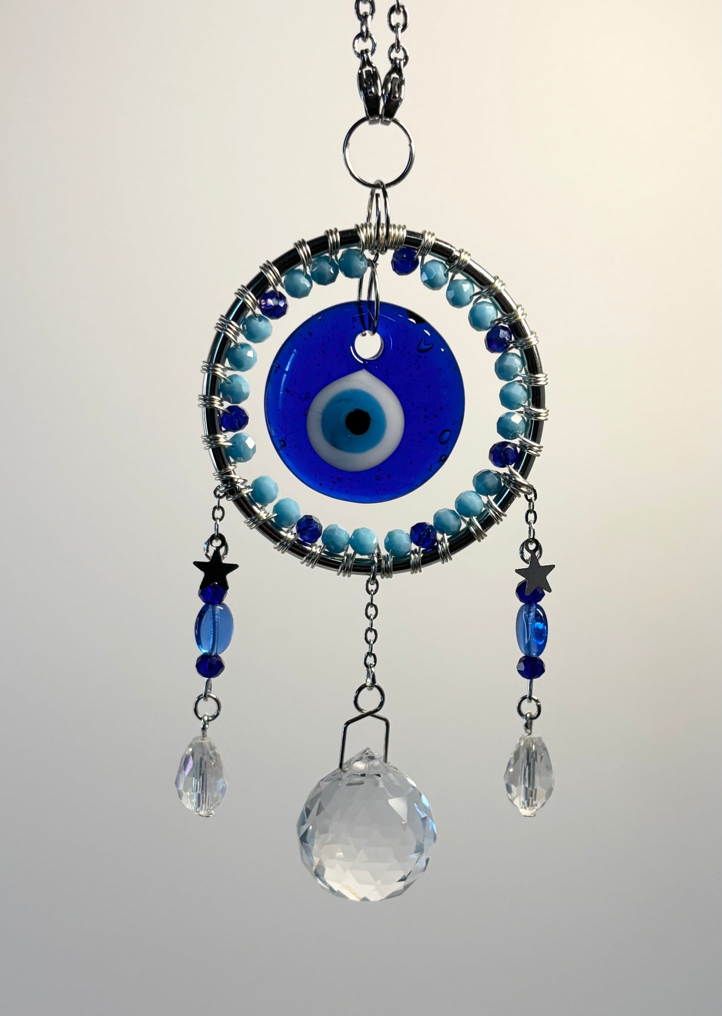 Silver Round Metal Frame with Mixed Blues & Evil Eye